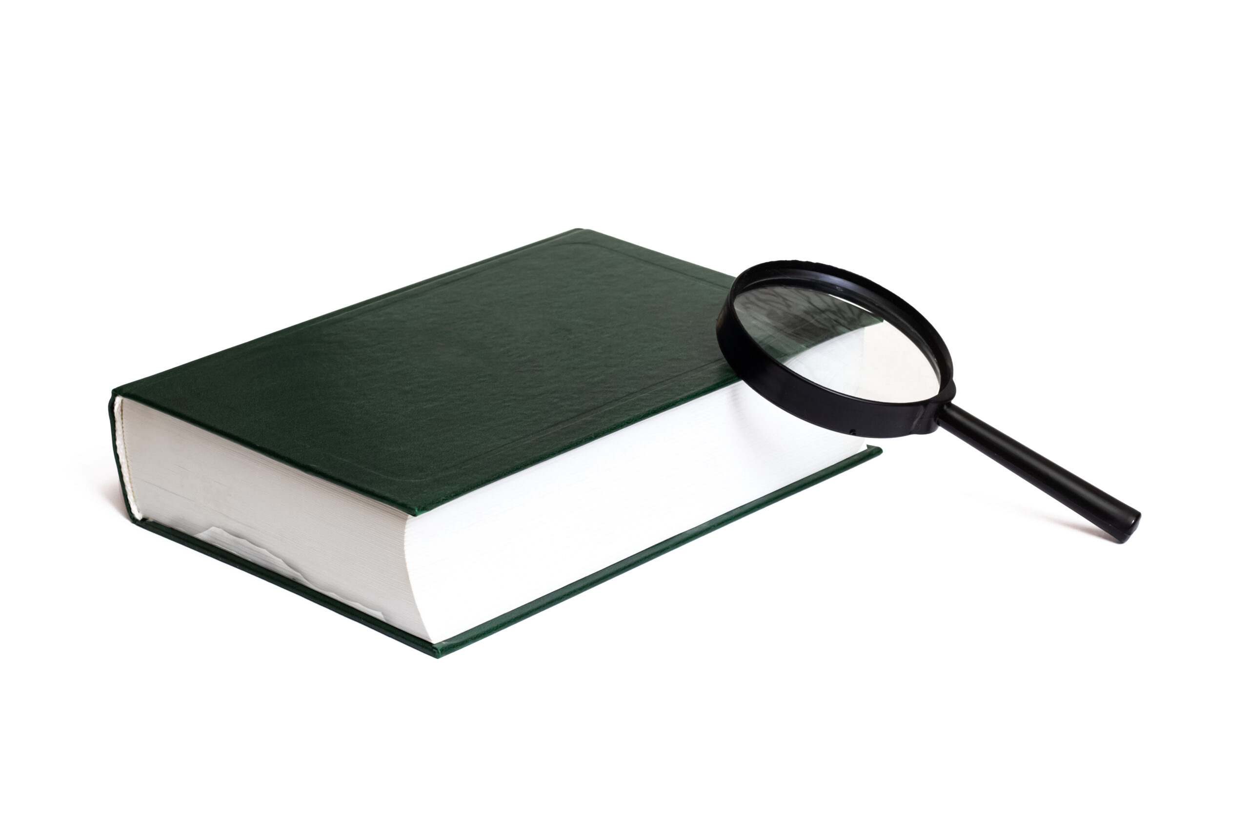Green cover book and magnifier isolated on white background